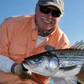 Angler who knows where to go fishing in Bay Area shows off striped bass