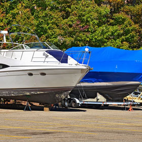 Power boat with blue shrink wrap