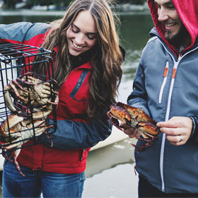 man and woman catching crab