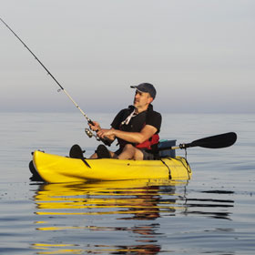 man kayak fishing