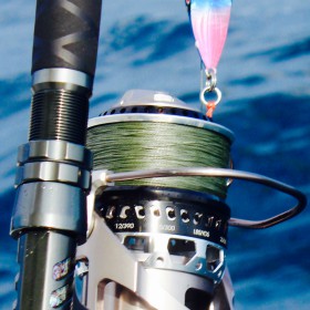 close-up view of ocean fishing rod with ocean in background